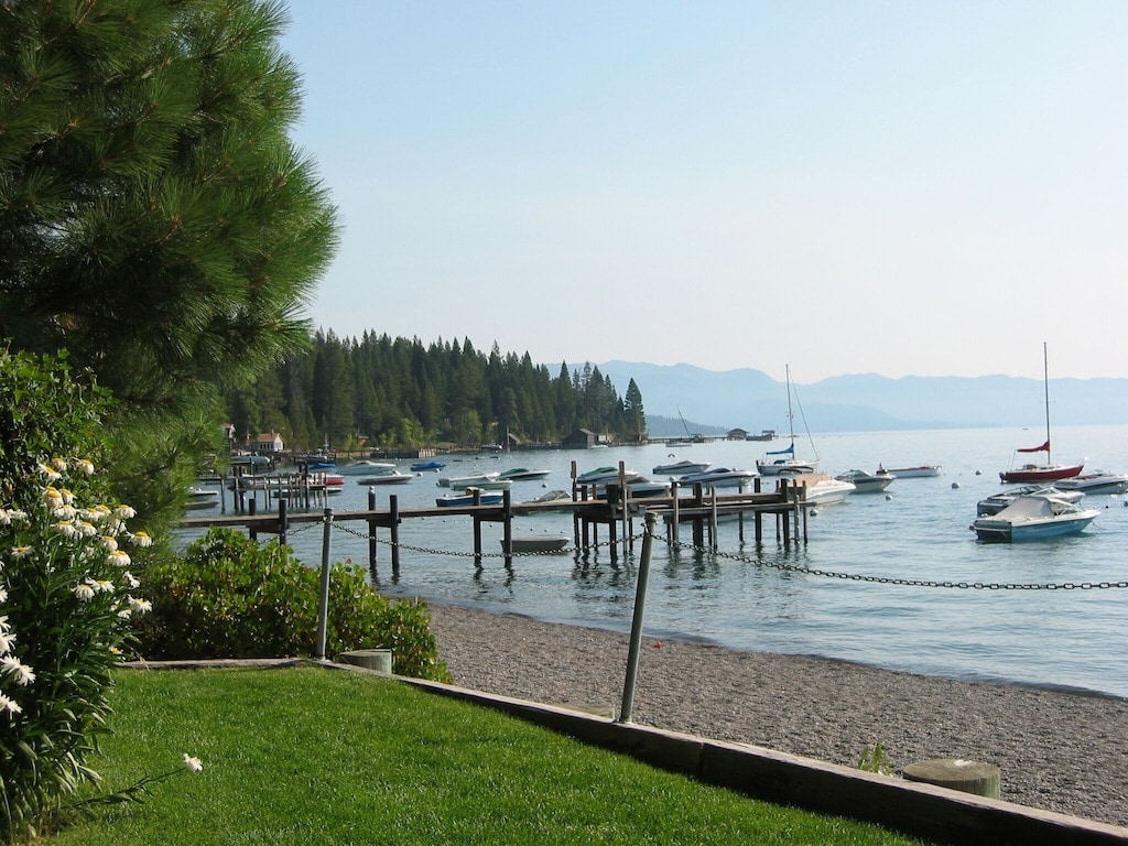 Private Tahoe Park homeowners beach with Lake Tahoe and mountain views.