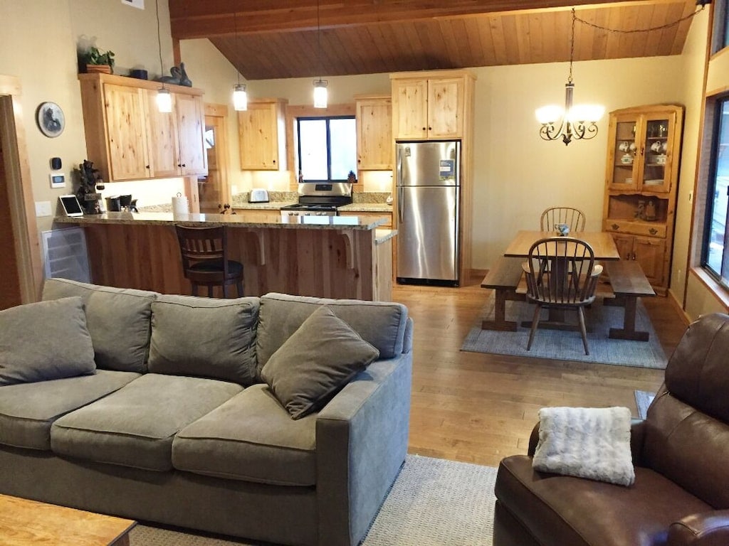 Living area opening to the kitchen and dining space.