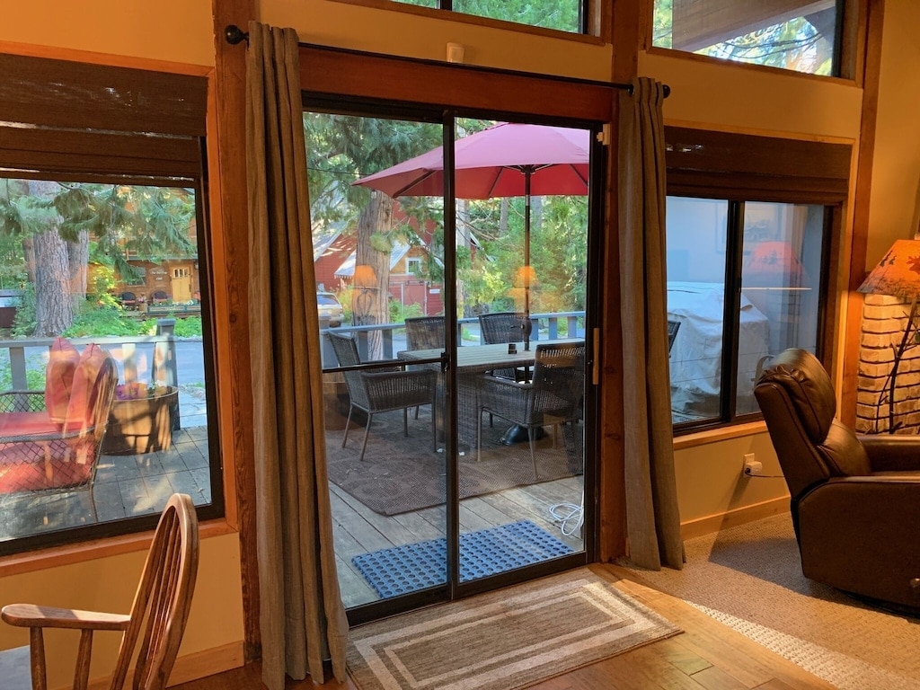 Sliding glass doors open from the living area to the deck.