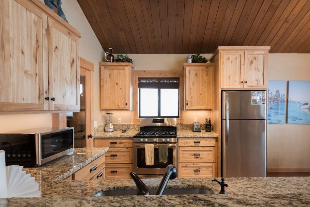 Kitchen range and granite counter workspace.