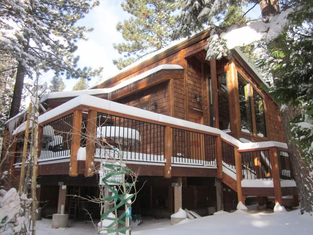 1555 Tahoe Park Ave in winter, with deck and snowy Tahoe setting.