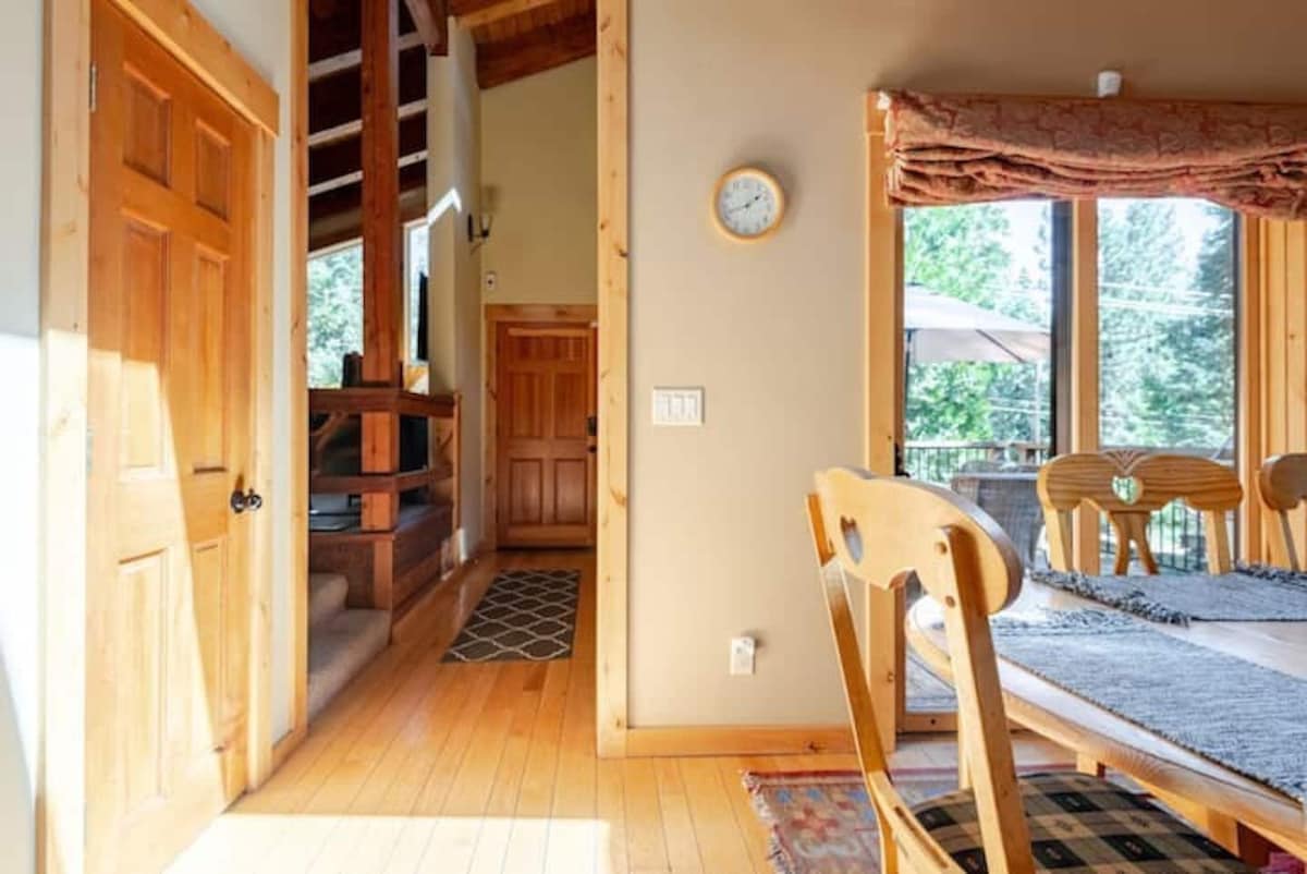 Dining area and staircase near the entry.
