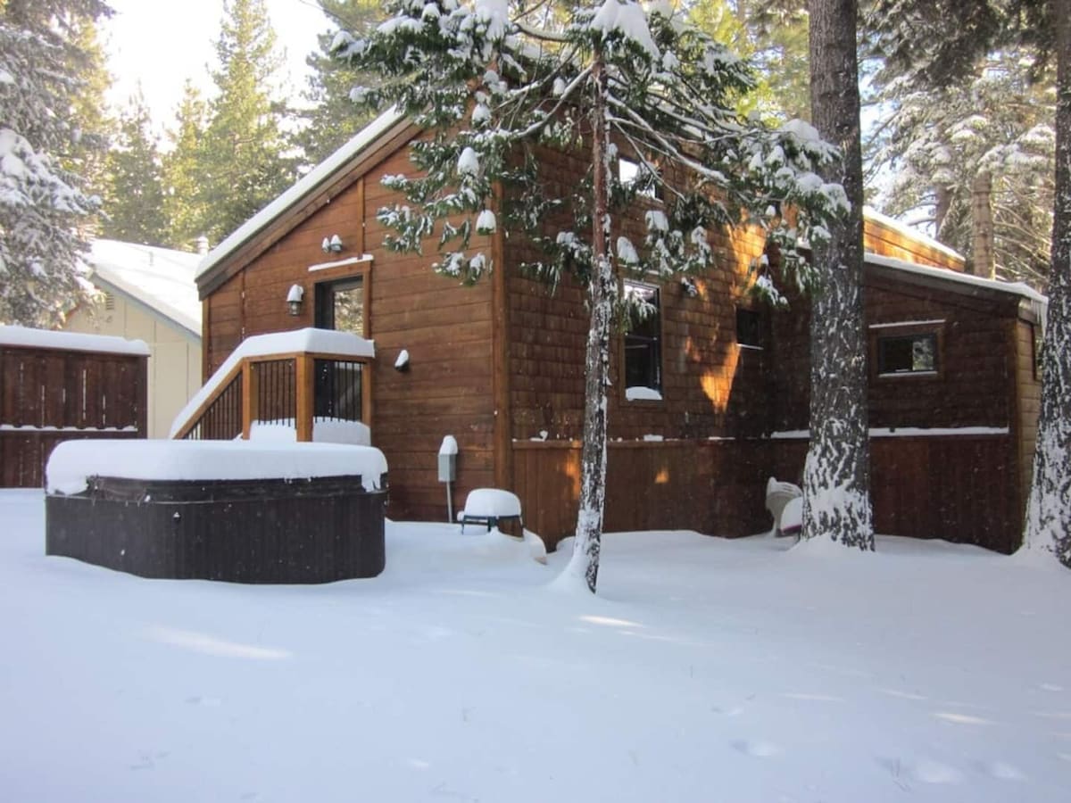 Backyard hot tub and exterior view in winter.