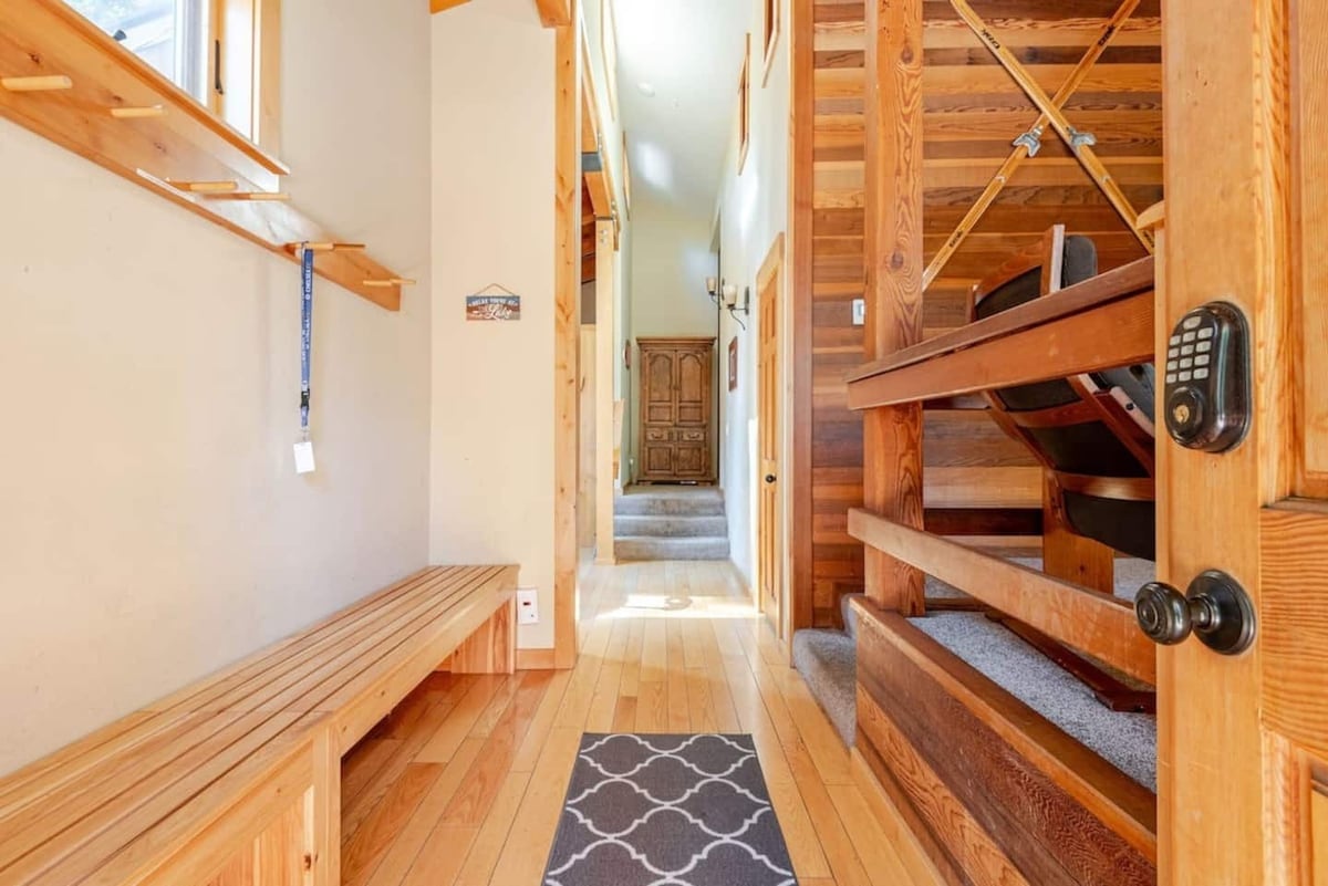 Entryway/mudroom bench and staircase.